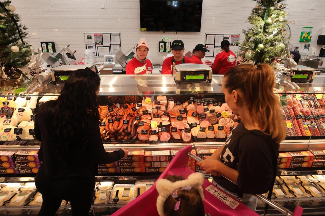Customers shop for deli meets at NetCost Market in Hollywood, Florida, on Thursday, Dec. 19, 2024.
