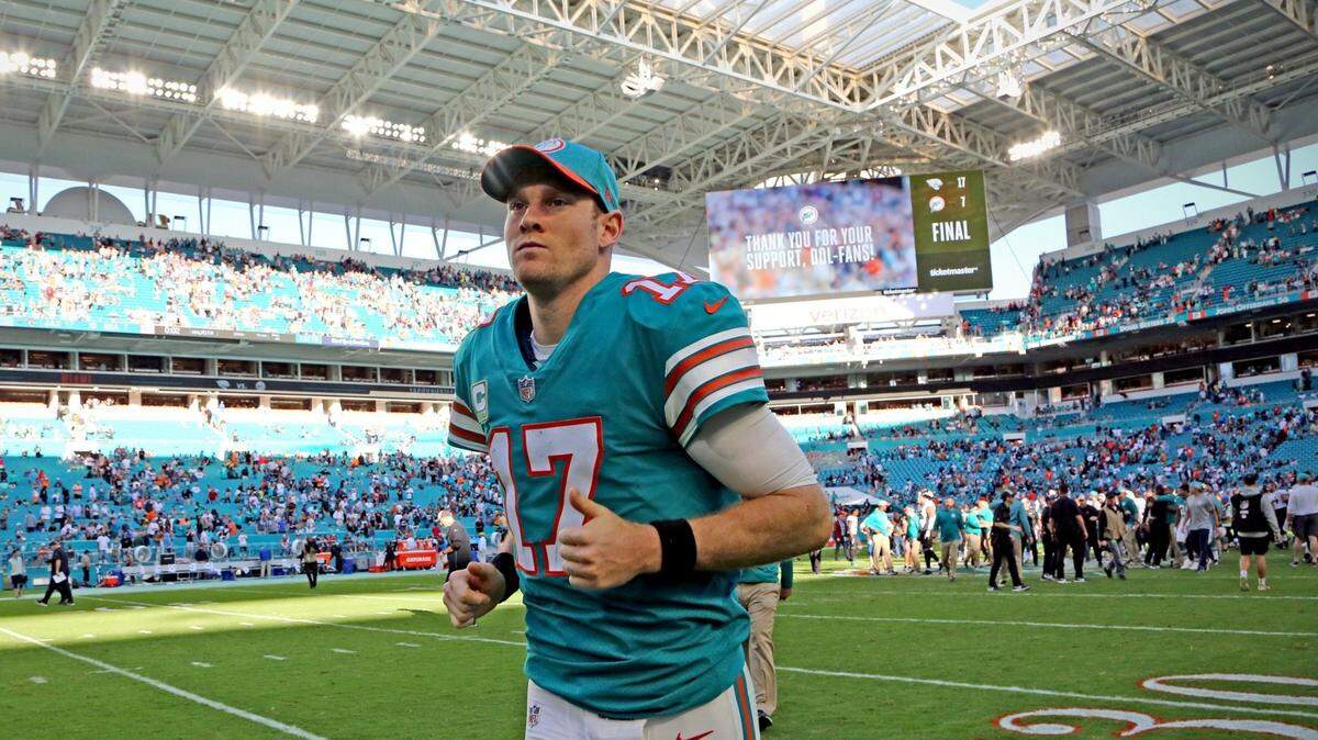 Miami Dolphins quarterback Ryan Tannehill (17) jogs off the field after the Miami Dolphins lose to the Jacksonville Jaguars at Hard Rock Stadium in Miami Gardens on Sunday, December 23, 2018.