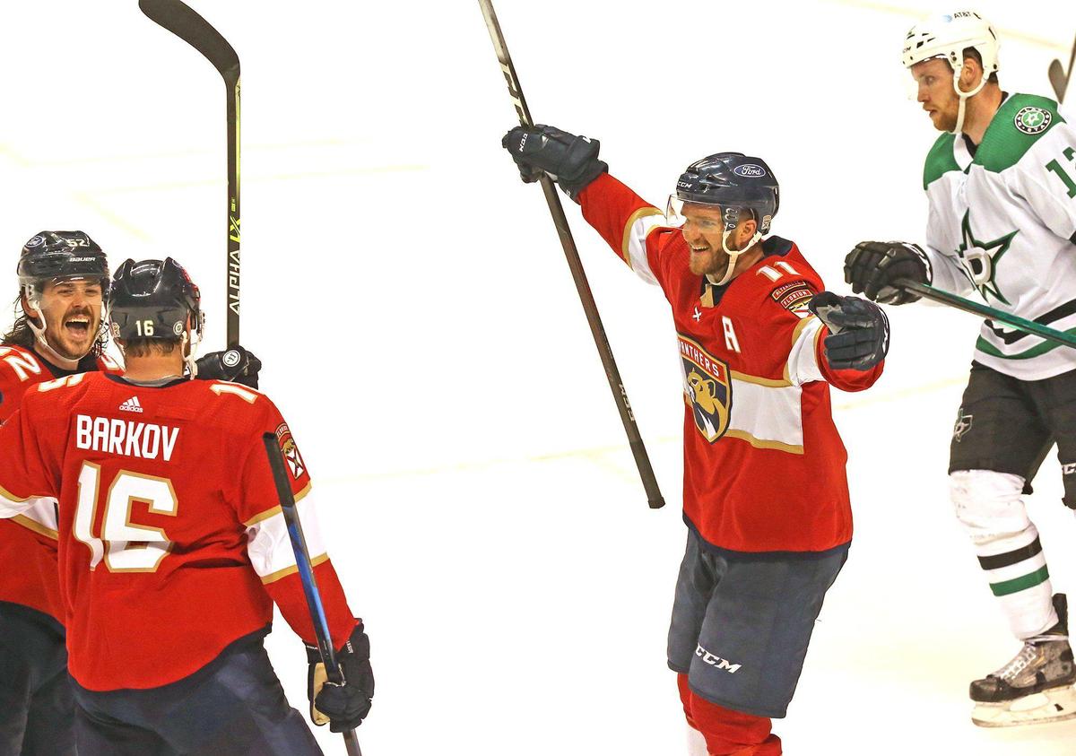  Aleksander Barkov celebrates with&nbsp;MacKenzie Weegar and Jonathan Huberdeau, right, after scoring the winning goal in overtime Monday at the BB&T Center.