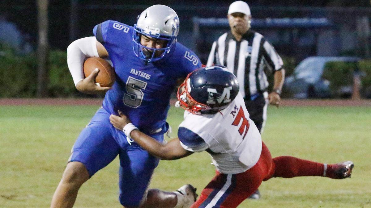 Dillard Panthers quarterback Nylan Maine (5) is tackled by Miramar Patriots linbacker Eric Kelly III during the football game on Saturday, September 23, 2023 at Dillard HS in Fort Lauderdale. Andrew Uloza / for Miami Herald