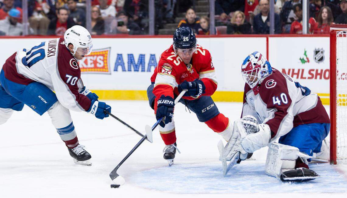 Florida Panthers right wing Mackie Samoskevich (25) tries to score against Colorado Avalanche goaltender Alexandar Georgiev (40) in the second period of their NHL game at Amerant Bank Arena on Saturday, Nov. 23, 2024, in Sunrise, Fla.