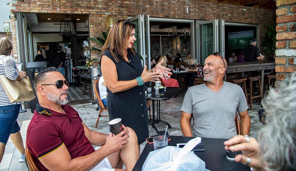 Blanca Cabrera, owner of Sergio’s Restaurants, talks with customers on May 8, 2021, at Sergio’s location in Coral Way, where she is working on an expansion to include a rooftop patio.