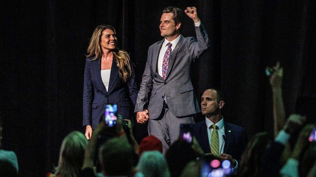 Florida Congressman Matt Gaetz, who recently triggered a historic vote to remove Republican Kevin McCarthy as Speaker of the House and his wife Ginger Gaetz, greets the crowd as former President Donald Trump introduced them at an event hosted by the pro-Trump Club 47 USA, at the West Palm Beach Convention Center on Wednesday, October 11, 2023.