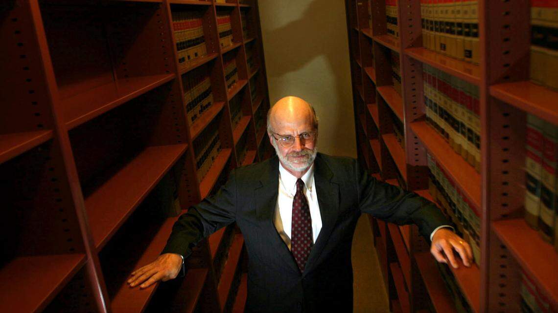 Randall Berg Jr., executive director of the Florida Justice Institute, Inc., stands in the law library of the law firm Steel, Hector & Davis in 2004.