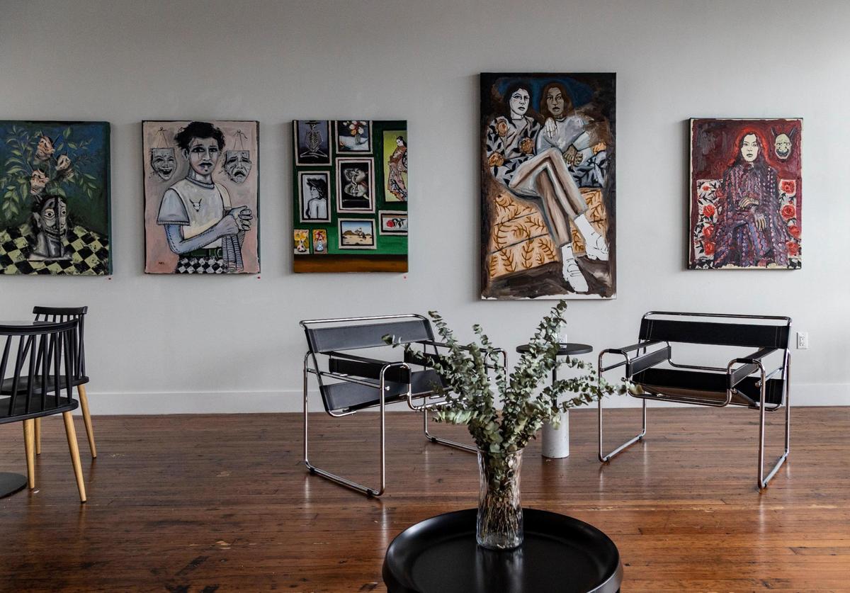 Javier Betancourt uses part of White Rose Coffee shop as a gallery space, displaying art from artists around the world, including this exhibit from Brooklyn artist Joel Baca.