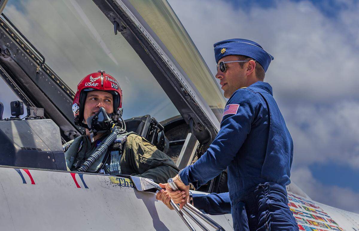 Maj. Samuel “RaZZ” Larson (right) discusses the flight plan with NFL star Jimmy Graham at the Homestead Air Reserve Base on Friday, May 22, 2026.
