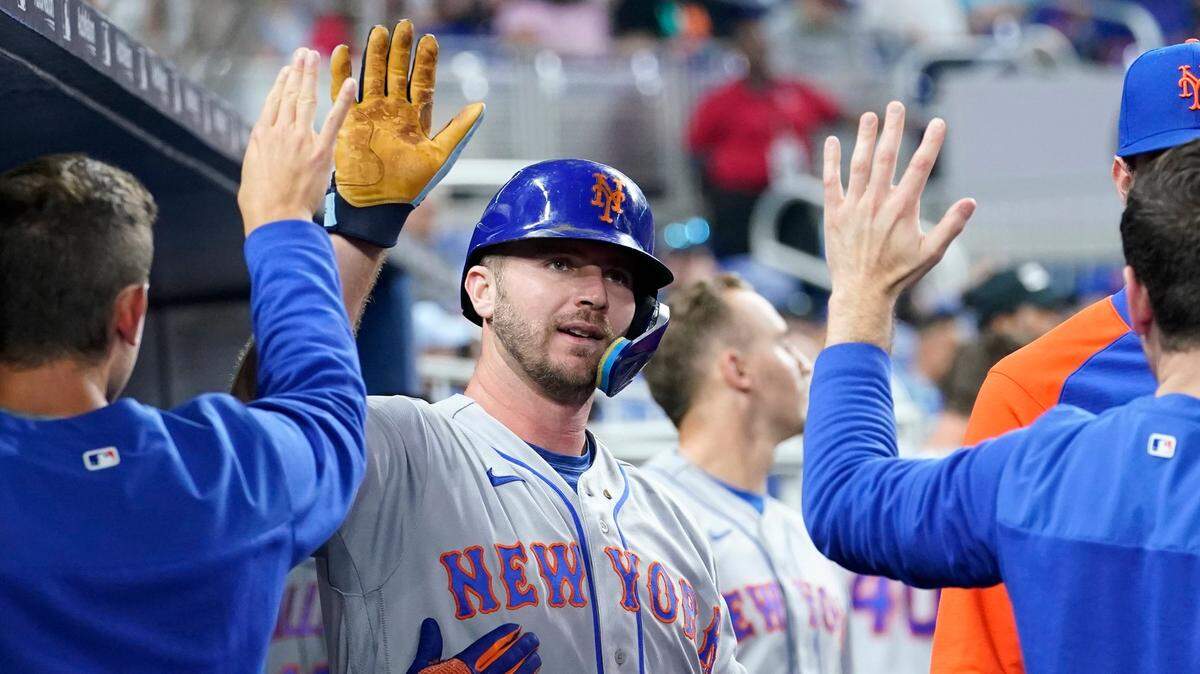 New York Mets’ Pete Alonso is congratulated after hitting a solo home run during the second inning of a baseball game against the Miami Marlins, Saturday, June 25, 2022, in Miami. (AP Photo/Lynne Sladky)