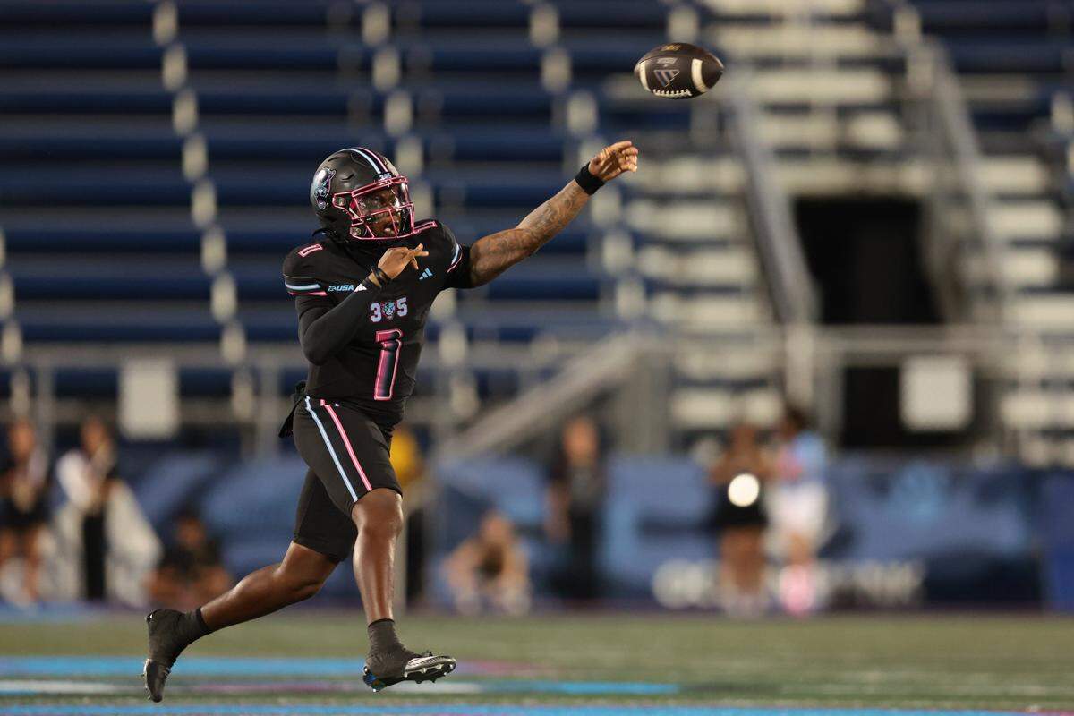 FIU Panthers quarterback Keyone Jenkins (1) passes the football against the Kennesaw State Owls during the first quarter at Pitbull Stadium in Miami, Florida, Tuesday, October 21, 2025.