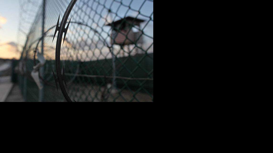 In this May 13, 2009 file photo reviewed by the U.S. military, the sun rises over the Guantanamo detention facility at dawn, at the Guantanamo Bay U.S. Naval Base, Cuba.