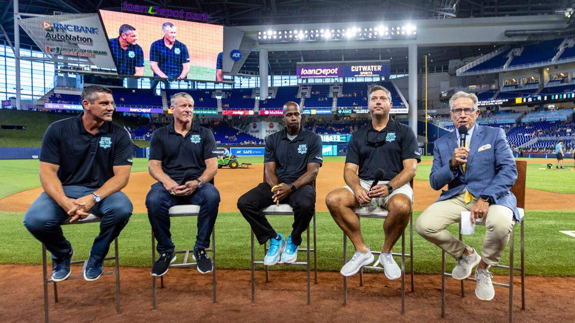 Former Miami Marlins players Carl Pavano, Jeff Conine, Juan Pierre and Josh Beckkett sit down with Tommy Hutton as they participate in a Q&A session before the first inning of an MLB game against the New York Yankees at loanDepot park in the Little Havana neighborhood of Miami, Florida, on Friday, August 11, 2023.