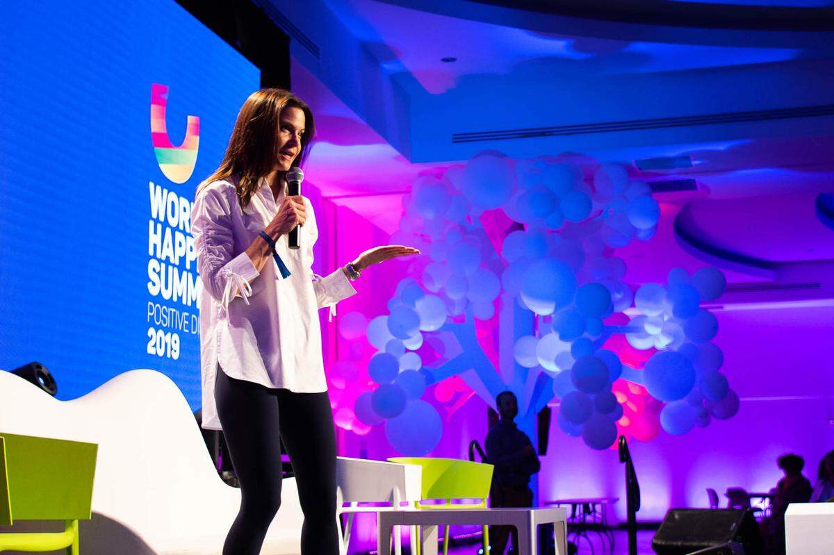Karen Guggenheim at the World Happiness Summit 2019, of which she is the co-founder & organizer.