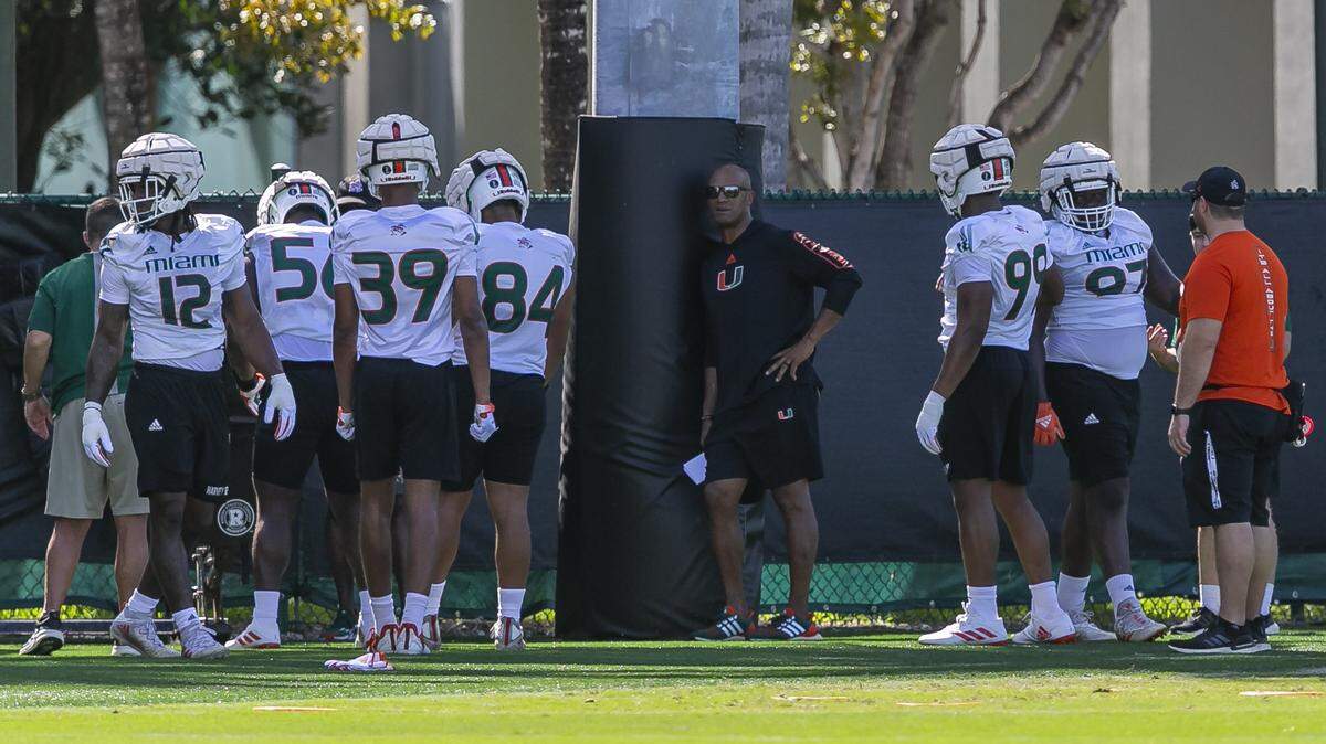 Miami Hurricanes off field analyst Jason Taylor, center, attends practice with his team at the University of Miamis Greentree Practice Fields in Coral Gables, Florida on Monday, March 7, 2022. Taylor will work with the defensive ends.