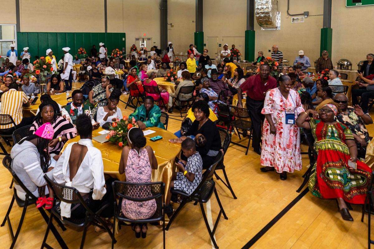 Guests mingle and enjoy performances before the meal