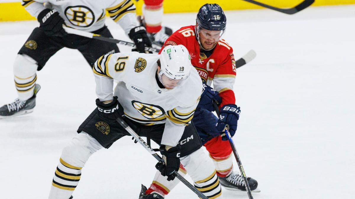 Florida Panthers center Aleksander Barkov (16) tries to keep the puck from Boston Bruins center John Beecher (19) during the second period of Game 5 of a second-round Stanley Cup Playoff series on Tuesday, May 14, 2024, at Amerant Bank Arena in Sunrise, Fla.