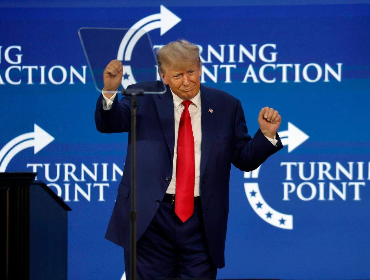 Donald Trump dances on stage during the Turning Point Action Conference at the Palm Beach County Convention Center in West Palm Beach, Florida, on Saturday, July 15, 2023.