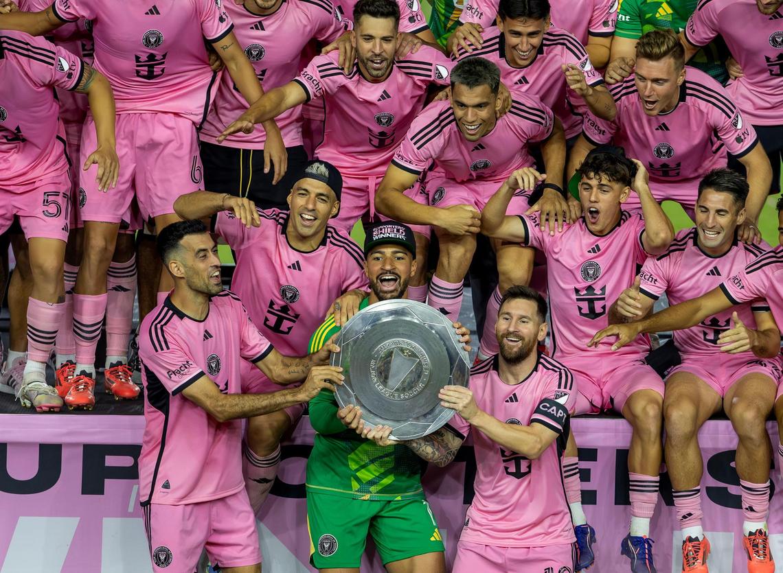 Inter Miami forward Lionel Messi (10) celebrates with his teammates Sergio Busquets (5) Luis Suárez (9) and Drake Callender (1) after winning the MLS Supporters’ Shield after their match against the New England Revolution at Chase Stadium on Saturday, October 19, 2024 in Fort Lauderdale, Florida.