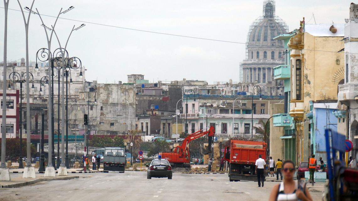A police car patrols the streets of Havana.