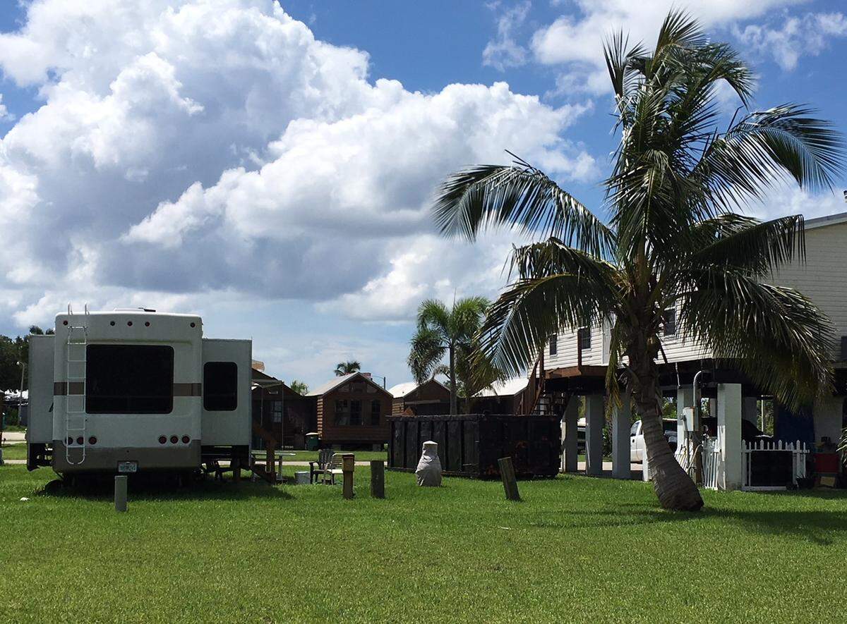 Since January, Dottie Joiner and her husband have been living in a trailer next to their stilt house while they await repairs. Photo by Jenny Staletovich/Miami Herald staff