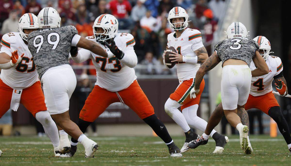 Miami Hurricanes quarterback Carson Beck (11) looks to pass against the Virginia Tech Hokies in the second half at Lane Stadium in Blacksburg, Virginia, on Saturday, November 22, 2025.