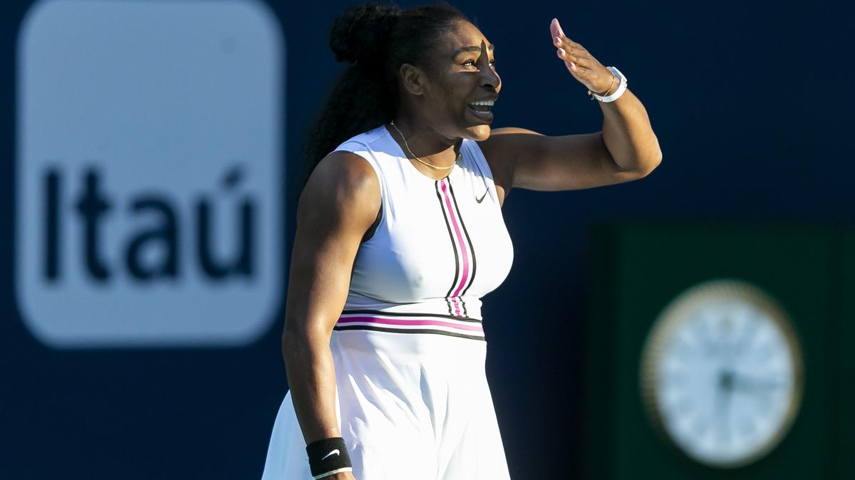 Serena Williams, of the United States, reacts to the sunlight during her match against Rebecca Peterson, of Sweden, at the Miami Open tennis tournament on Friday, March 22, 2019 at Hard Rock Stadium in Miami Gardens.