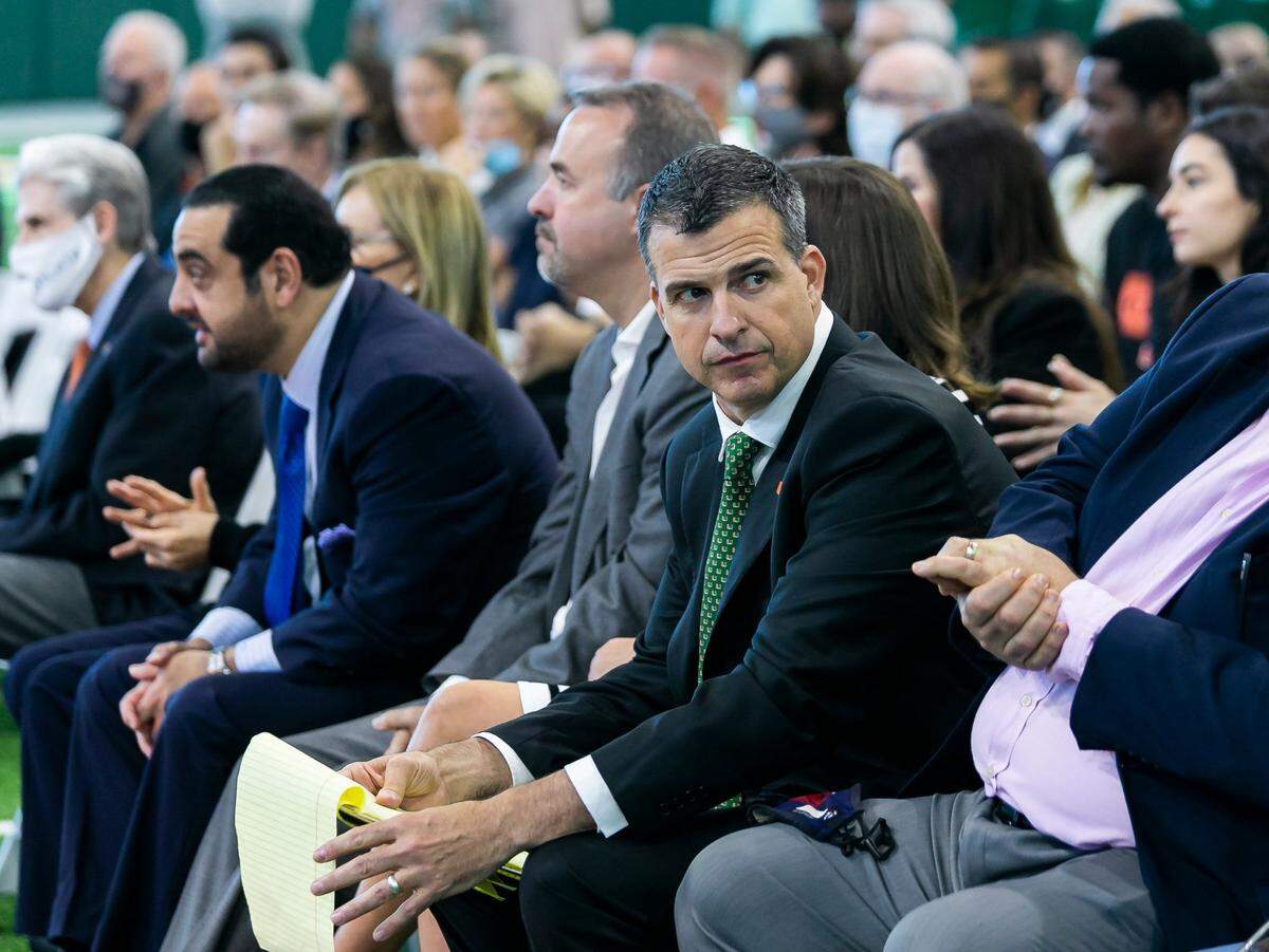 Mario Cristobal, the newly hired head football coach of the Miami Hurricanes, waits for the start of a press conference at the Carol Soffer Indoor Practice Facility inside the University of Miami in Coral Gables, Florida on Tuesday, December 7, 2021.