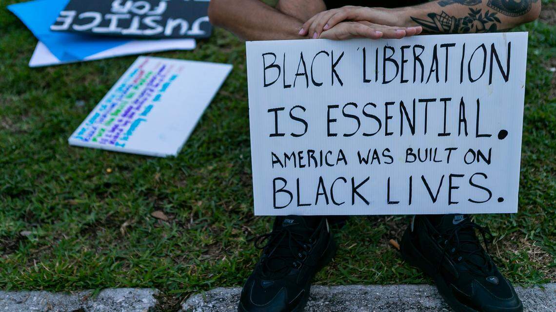Activists participate in a Black Lives Matter protest in downtown Miami near Bayside in August 2020, part of a string of rallies and demonstrations in the wake of killing of George Floyd during a Minneapolis arrest. Outcry over Floyd’s death helped spur Miami-Dade County commissioners to revive a police review panel, but it has yet to meet in the spring of 2021.