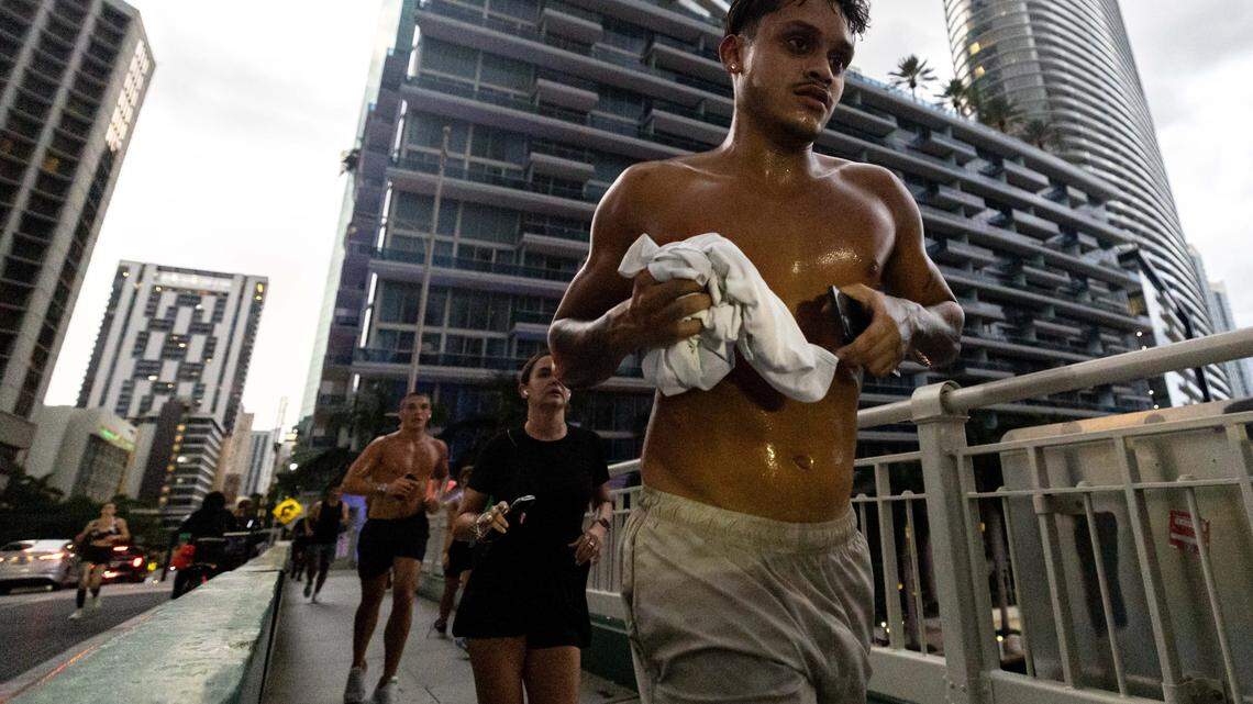 Members of the Brickell Run Club jog over the Brickell Avenue Bridge on Tuesday, September 3, 2025, in Miami, Fla.