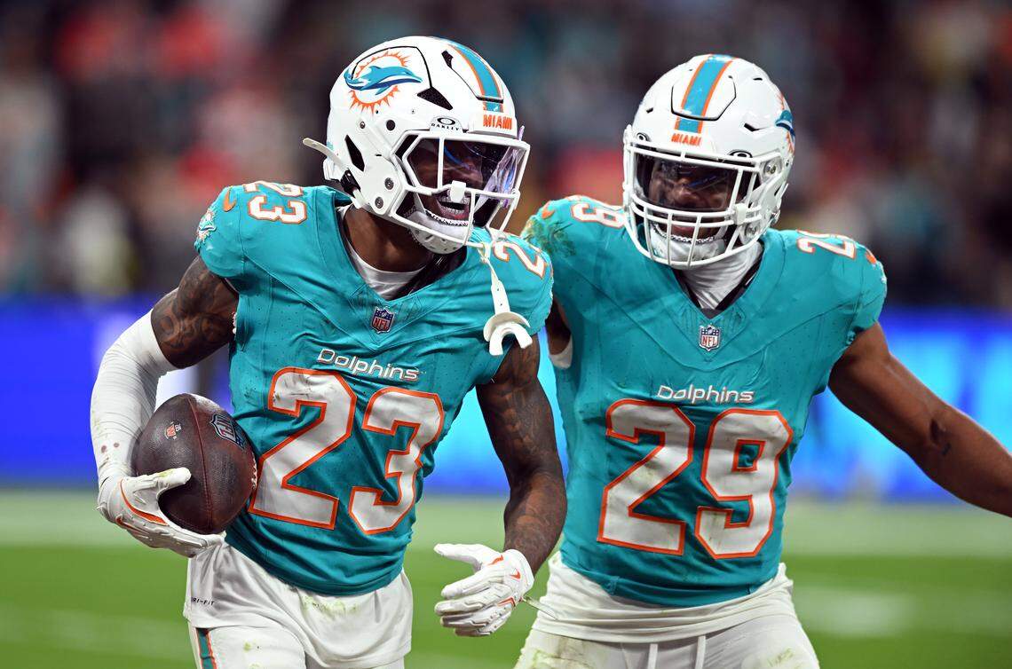 MADRID, SPAIN - NOVEMBER 16: Artie Burns of Miami Dolphins (#23) and Minkah Fitzpatrick of Miami Dolphins (#29) celebrate winning possession of the ball during the NFL 2025 game between Washington Commanders and Miami Dolphins at Estadio Santiago Bernabeu on November 16, 2025 in Madrid, Spain. (Photo by Denis Doyle/Getty Images)