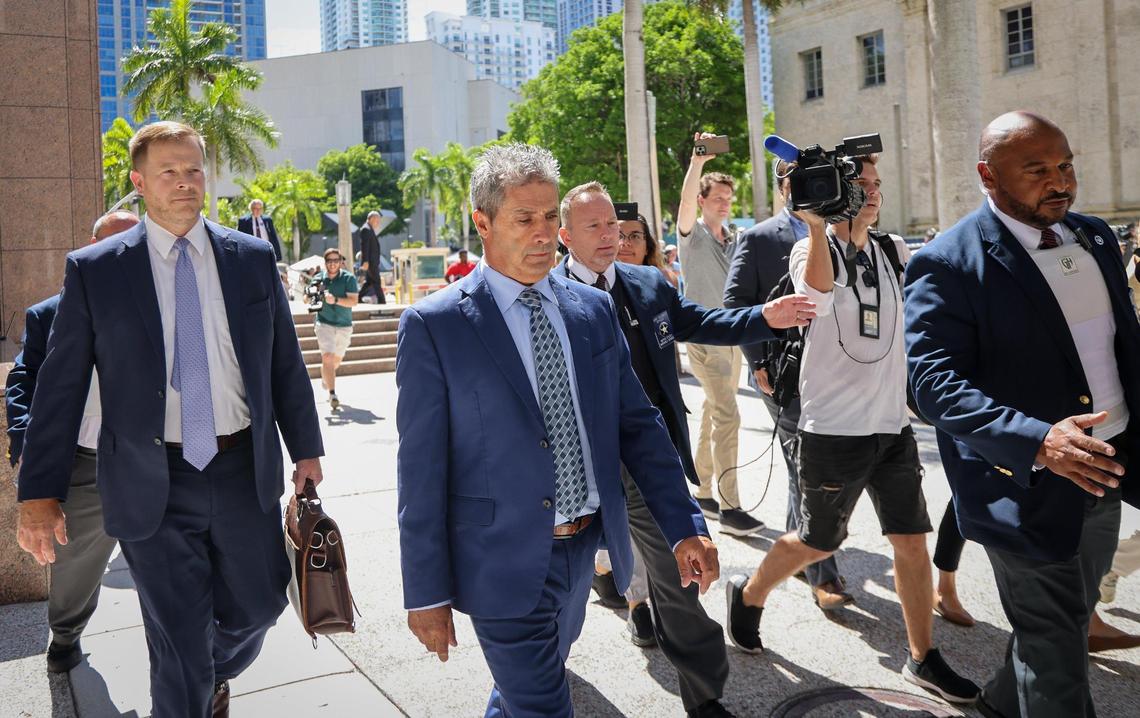 Carlos De Oliveira, a property manager at Donald Trump’s Mar-a-Lago estate, leaves federal court on Monday in Miami. He faces charges of scheming with the former president to hide security footage from investigators probing Trump’s hoarding of classified documents/ His formal arraignment was postponed until May 10 because he has not yet retained a South Florida attorney.