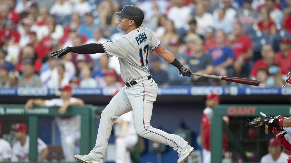 Joe Panik #12 of the Miami Marlins hits a solo home run in the top of the second inning against the Philadelphia Phillies at Citizens Bank Park on June 30, 2021 in Philadelphia, Pennsylvania.