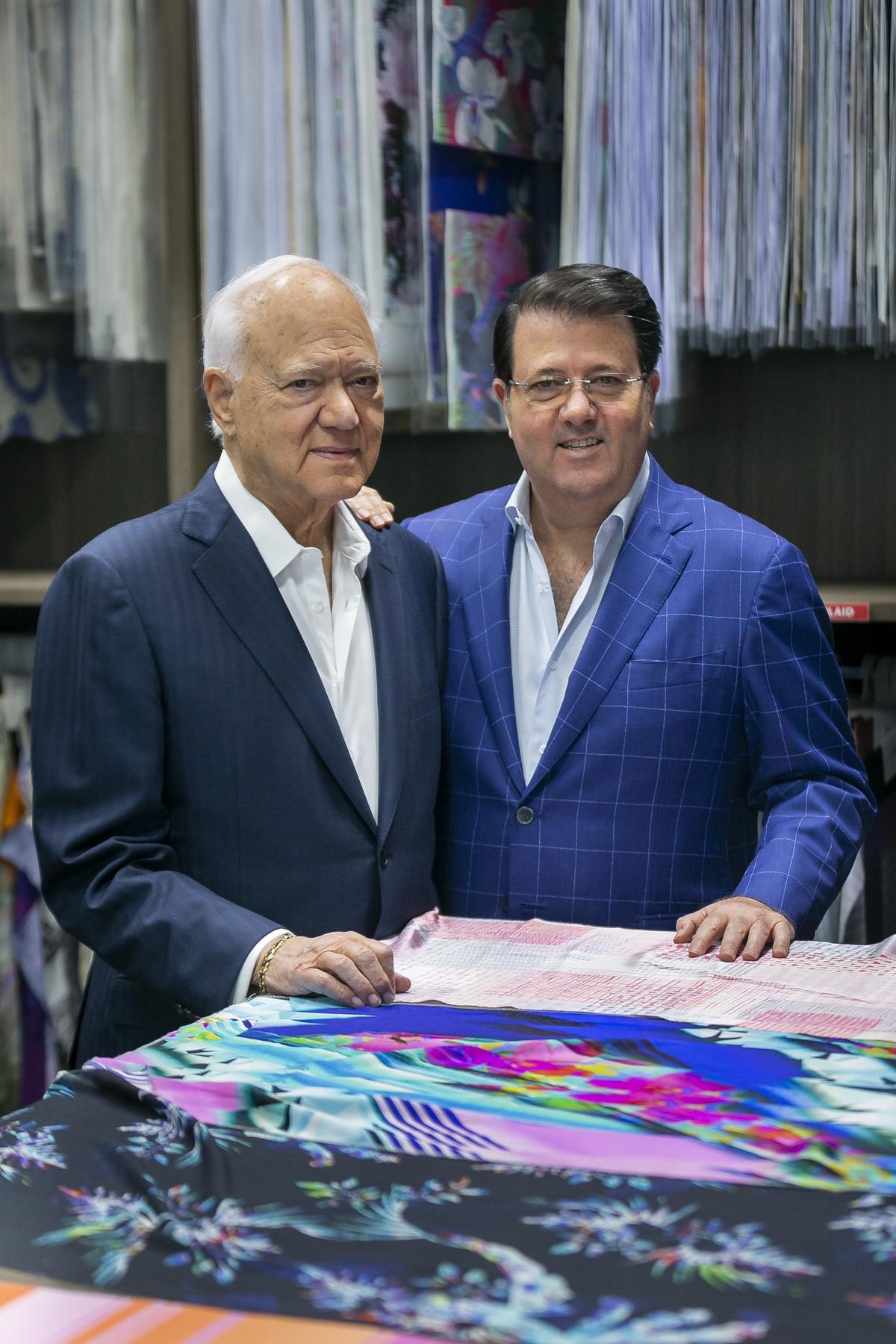 George Feldenkreis, left, and his son, Oscar Feldenkreis, the CEO and president of Perry Ellis, work from their headquarters in Doral in this file photo from Oct. 25, 2018.