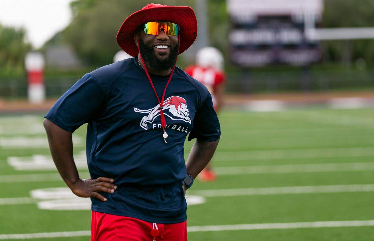 Chaminade-Madonna head coach Dameon Jones watches his team during a football practice at his school’s field in Hollywood, Florida on Wednesday, August 25, 2021.
