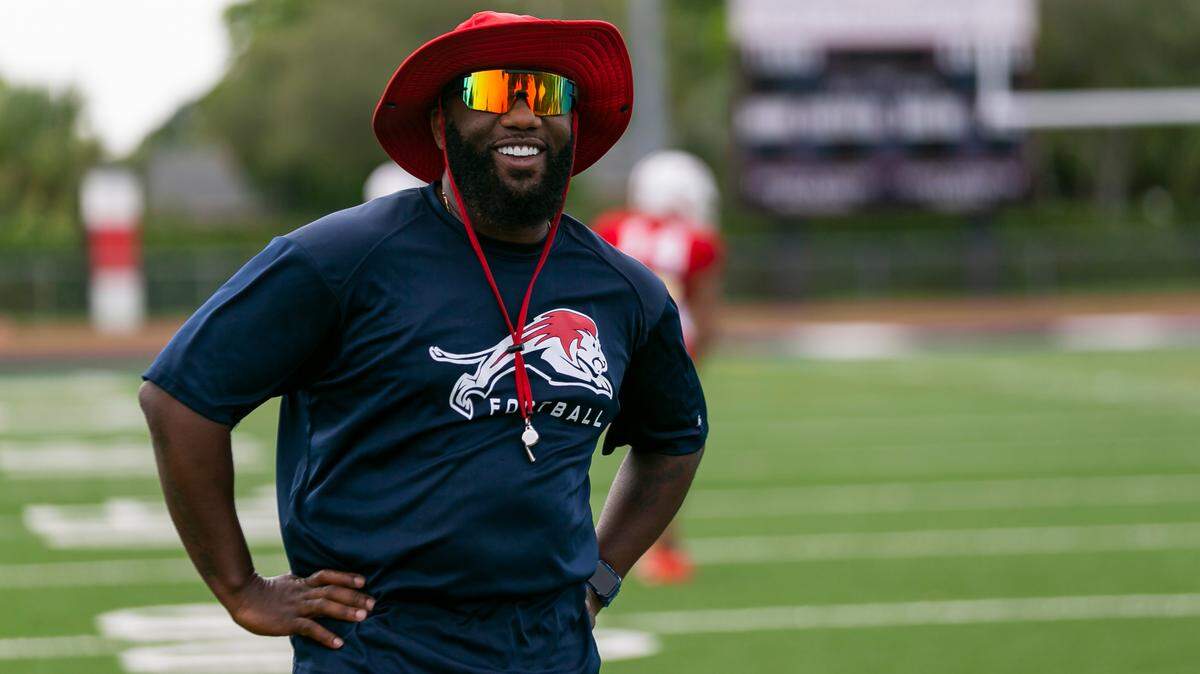Chaminade-Madonna head coach Dameon Jones watches his team during a football practice at his school’s field in Hollywood, Florida on Wednesday, August 25, 2021.