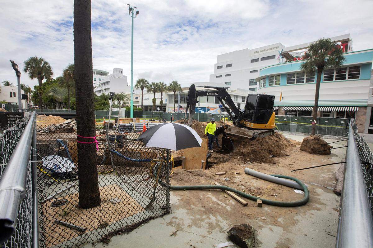 Excavators rip up a section of Drexel Avenue at Lincoln Road Mall in Miami Beach that will be pedestrianized as part of an extensive renovation of the famed pedestrian street.