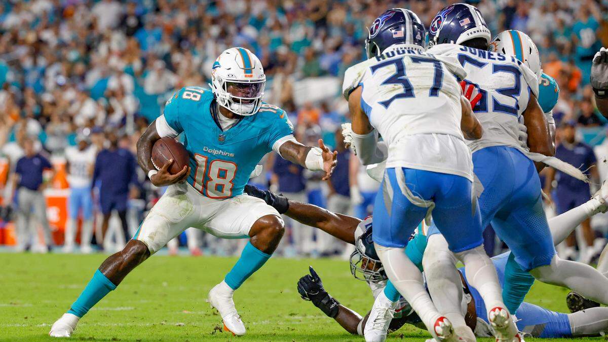 Miami Dolphins quarterback Tyler Huntley (18) carries the ball to score against the Tennessee Titans in the second half of their NFL game at Hard Rock Stadium on Monday, September 30, 2024, in Miami Gardens, Fla. 
