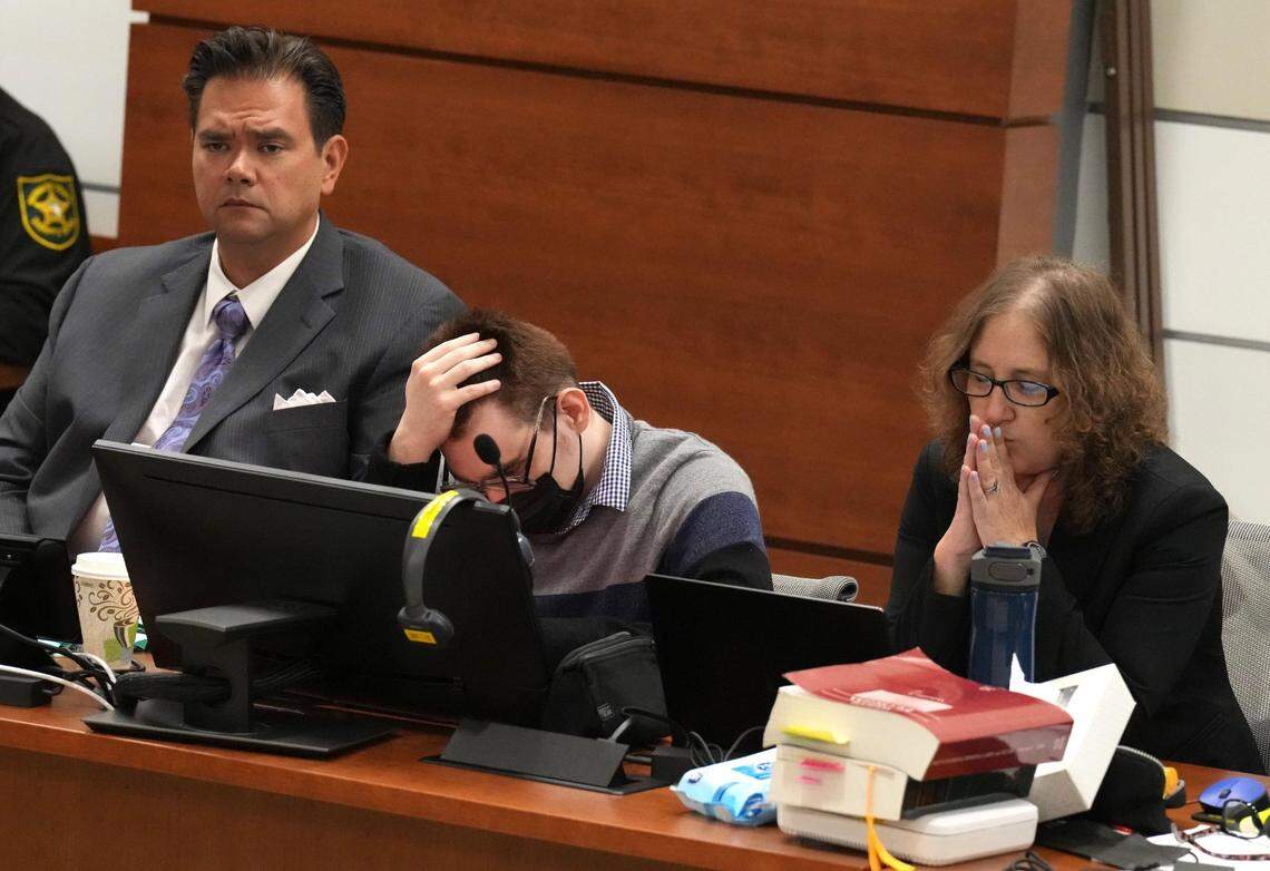Marjory Stoneman Douglas High School shooter Nikolas Cruz, center, slumps forward during the penalty phase of his trial at the Broward County Courthouse in Fort Lauderdale on Monday, July 18, 2022. Cruz previously pleaded guilty to all 17 counts of premeditated murder and 17 counts of attempted murder in the 2018 shootings.
