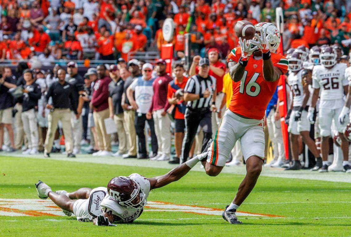 Miami Hurricanes wide receiver Isaiah Horton (16) catches a pass as Texas A&M Aggies defensive back Jayvon Thomas (14) defends during the second quarter of an NCAA non conference game at Hard Rock Stadium on Saturday, Sept. 9, 2023 in Miami Gardens, Florida.