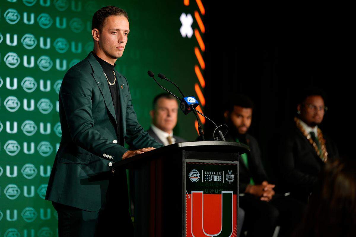 Jul 22, 2025; Charlotte, NC, USA; Miami quarterback Carson Beck answers questions from the media during ACC Media Days at Hilton Charlotte Uptown.