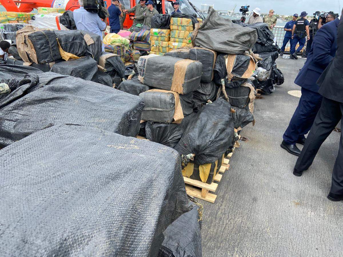 Packages of cocaine and marijuana are stacked on the deck of the U.S. Coast Guard Cutter James Thursday, Feb. 17, 2022.