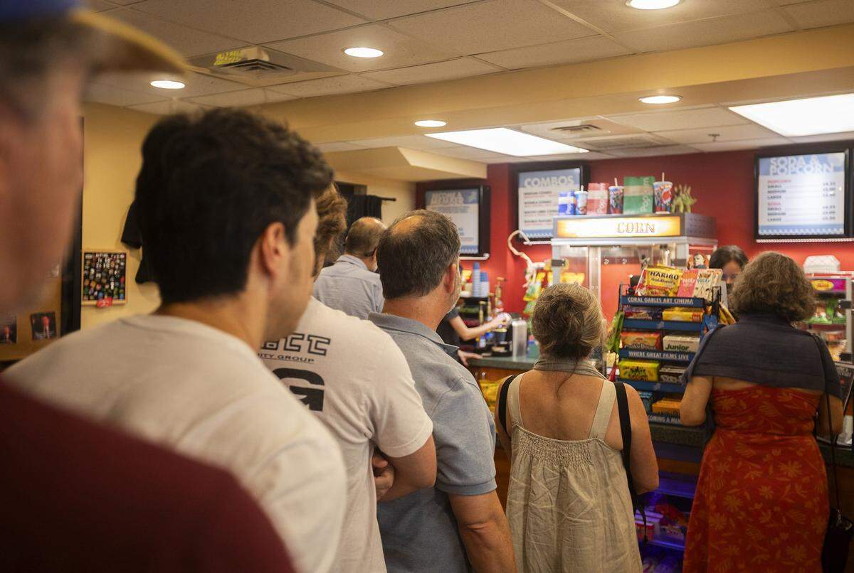 Moviegoers line up at the Coral Gables Art Cinema kiosko before the Japonese movie starts when Coral Gables Art Cinema is adding an extension next to the original theater, Coral Gables on Sunday August 3rd. 2025.