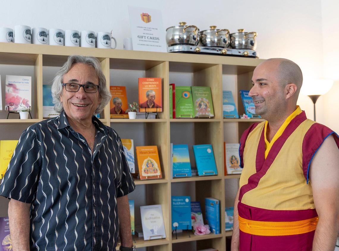 (Left) Todd Ellenberg, student and volunteer teacher, and Gen Kelsang Tashi, resident teacher at Kadampa Meditation Center Miami, converse with each other, on Friday, June 27, 2025, in Miami, Florida.