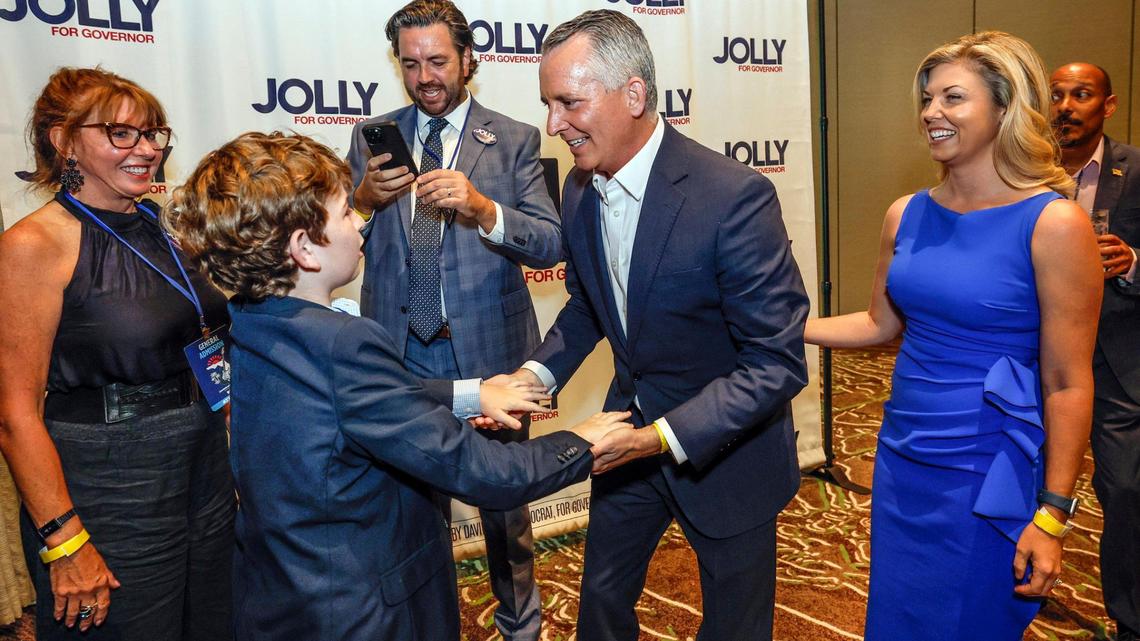Candidate for Florida governor David Jolly meets with Mason Podvin, 10, during the Florida Democratic Party annual Leadership Blue Gala at the Hard Rock Hotel and Casino in Hollywood, Florida on Saturday, June 21, 2025.