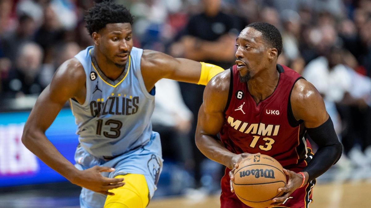 Miami Heat center Bam Adebayo (13) drives with the ball as Memphis Grizzlies forward Jaren Jackson Jr. (13) defends during the second quarter of an NBA game at the Miami-Dade Arena on Wednesday, March 15, 2023, in downtown Miami, Fla.