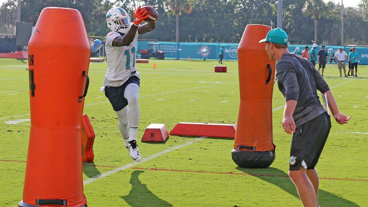 Miami Dolphins wide receiver DeVante Parker catches a pass during a drill on the first day of training camp at  Miami Dolphins training facility in Davie, Florida, July 26, 2018. 