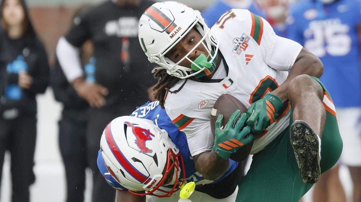 Miami Hurricanes wide receiver Malachi Toney (10) is hit on a pass reception by Southern Methodist University Mustangs safety Ahmaad Moses (3) during the first half of an NCAA football game at Gerald Ford Stadium on Saturday, November 1, 2025, in Dallas, Texas.