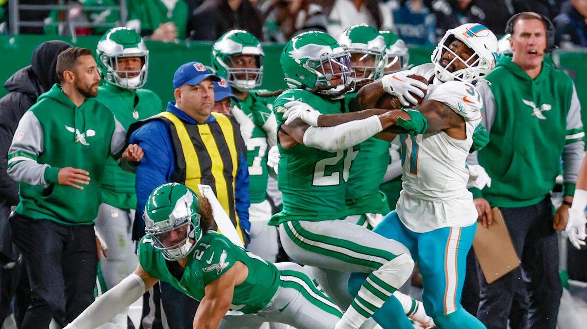 Miami Dolphins running back Raheem Mostert (31) battles Philadelphia Eagles safety Terrell Edmunds (26) on a carry in the second half at Lincoln Financial Field, Philadelphia, PA on Sunday, October 22, 2023.