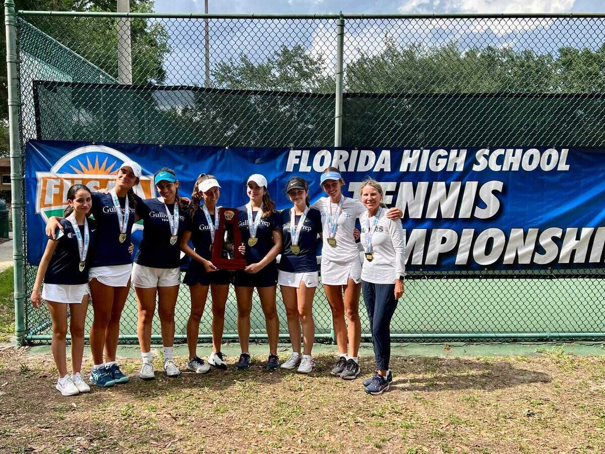 Gulliver's girls' tennis team celebrates after winning the Class 2A state championship on Thursday in the Orlando area.