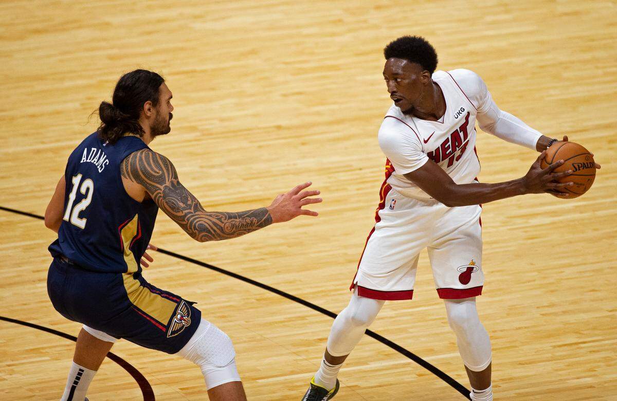 Miami Heat center Bam Adebayo (13) in action against New Orleans Pelicans center Steven Adams (12) in the first quarter of an NBA basketball preseason game at the AmericanAirlines Arena on Monday, December 14, 2020.