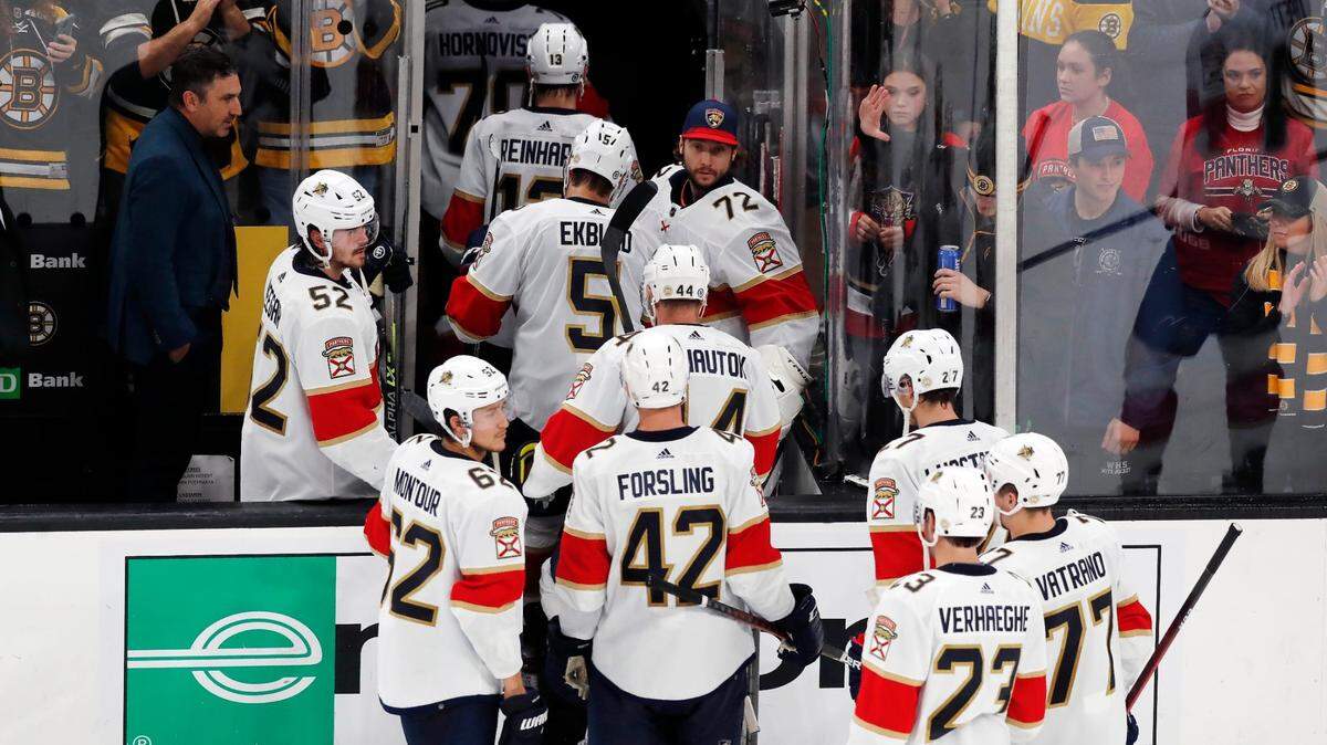 The Florida Panthers leave the ice after losing to the Boston Bruins in a shootout during an NHL hockey game, Saturday, Oct. 30, 2021, in Boston. (AP Photo/Michael Dwyer)