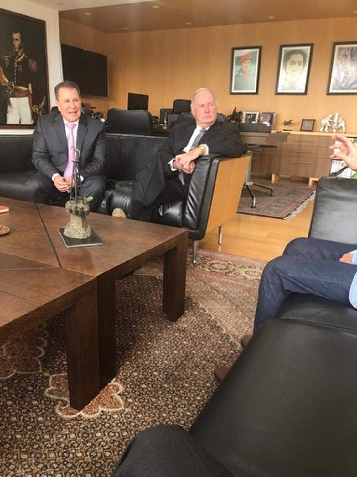 Miami businessman Hugo Perera, far left, and Gulf Stream magnate Harry Sargeant III, next to him on couch, meet with Manuel Quevedo, not fully seen on right, president of Venezuela’s state-owned oil company, PDVSA, in his Caracas office to discuss drilling deals with the Maduro government.